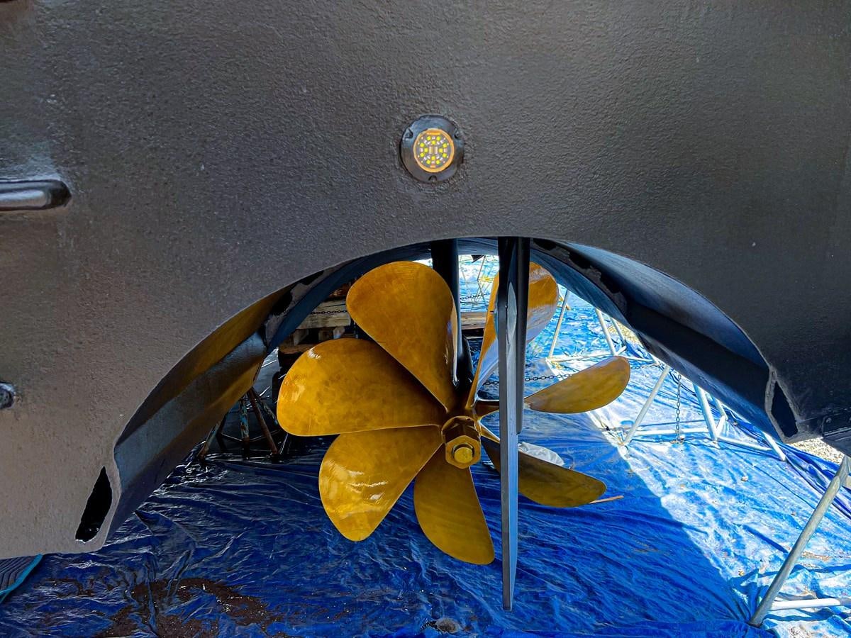 a yellow toy on a blue surface aboard DESTINI IV Yacht for Sale