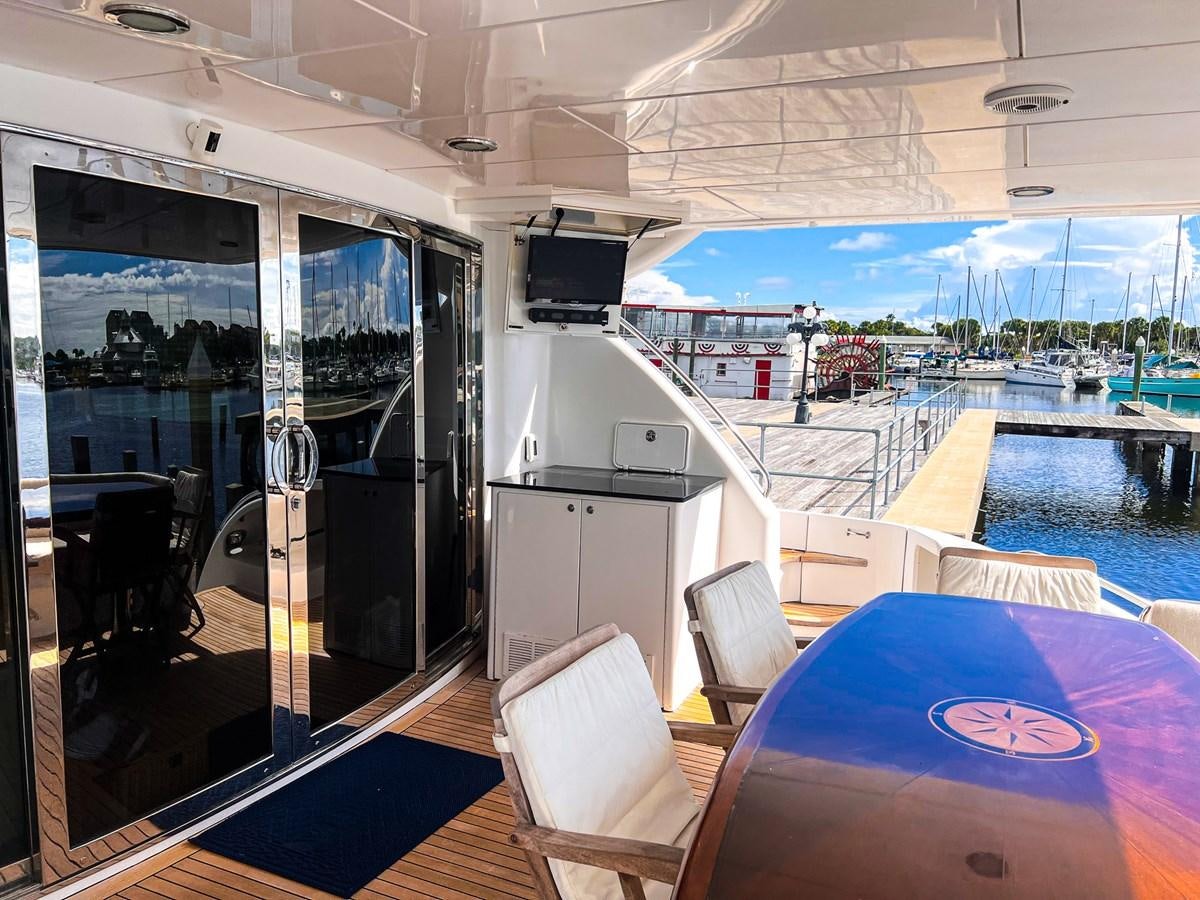 a room with a pool table and chairs aboard DESTINI IV Yacht for Sale