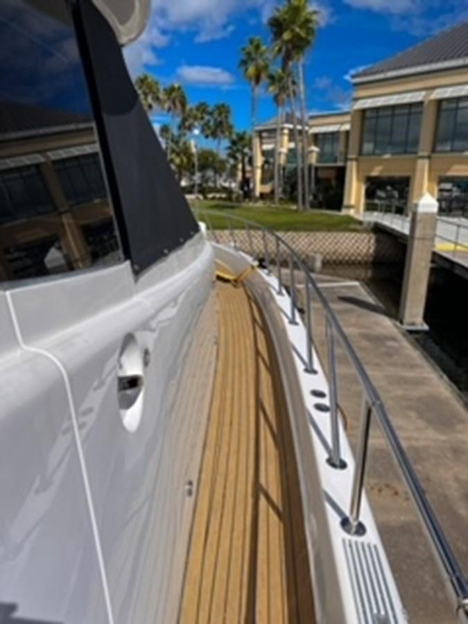 a white car with a wooden handle aboard DESTINI IV Yacht for Sale