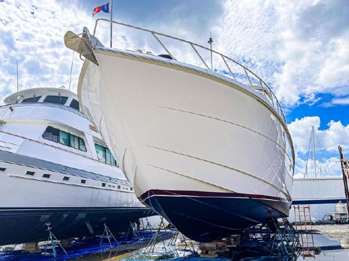 a few large boats are parked aboard DESTINI IV Yacht for Sale