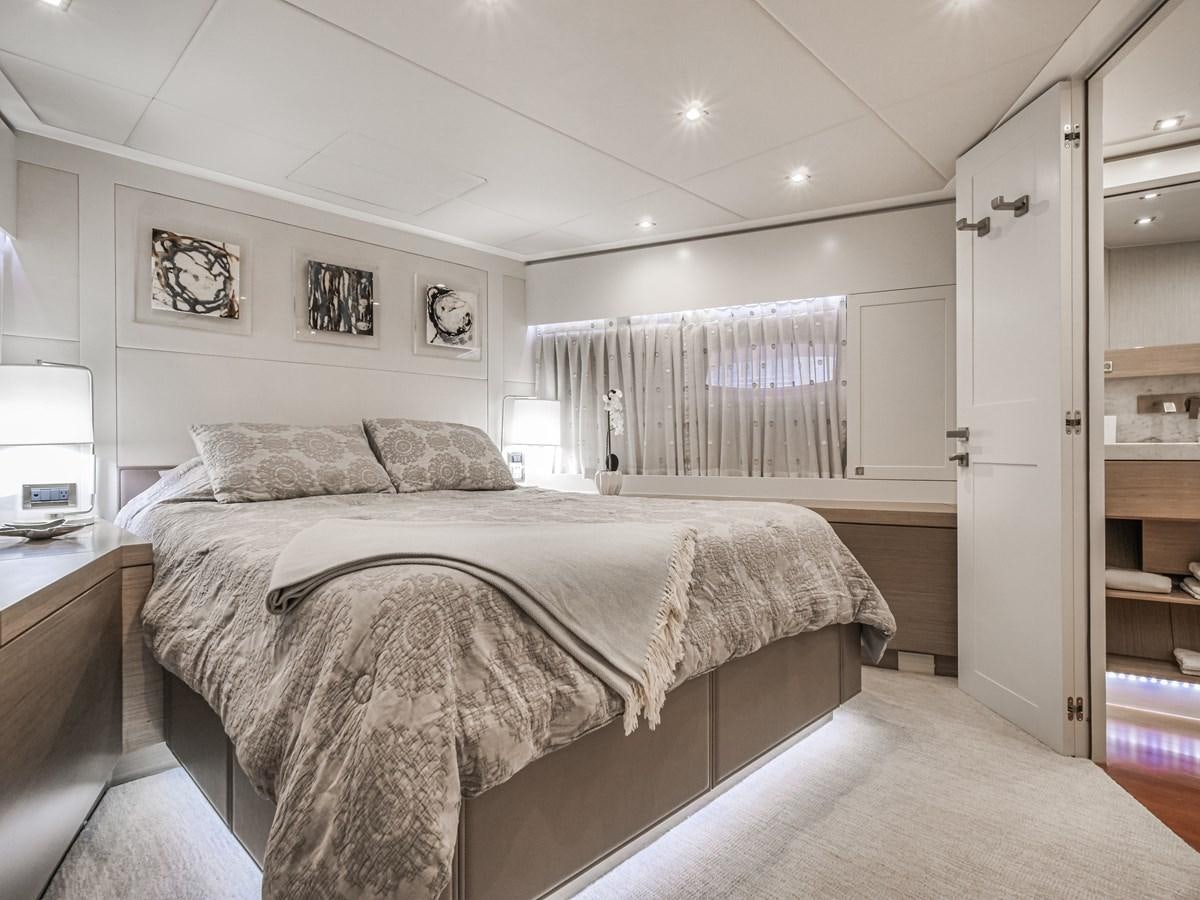 a bedroom with a bed and a desk aboard SEASEID Yacht for Sale