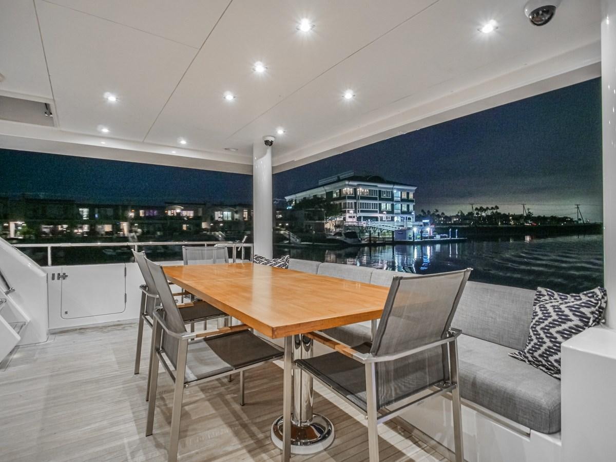 a table and chairs on a deck aboard SEASEID Yacht for Sale