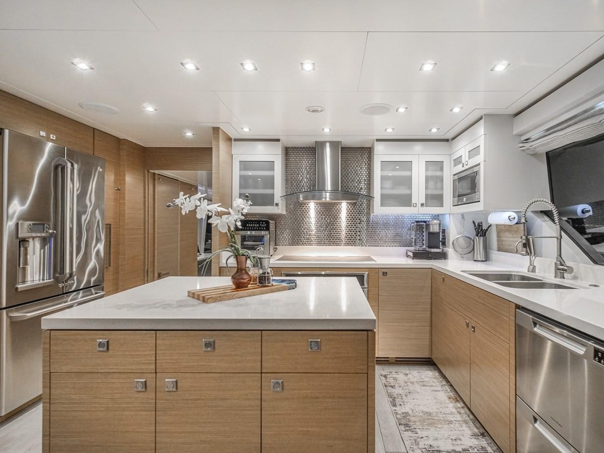 a kitchen with a large island aboard SEASEID Yacht for Sale