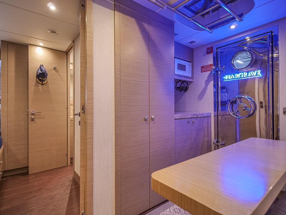 a room with a table and a door aboard SEASEID Yacht for Sale