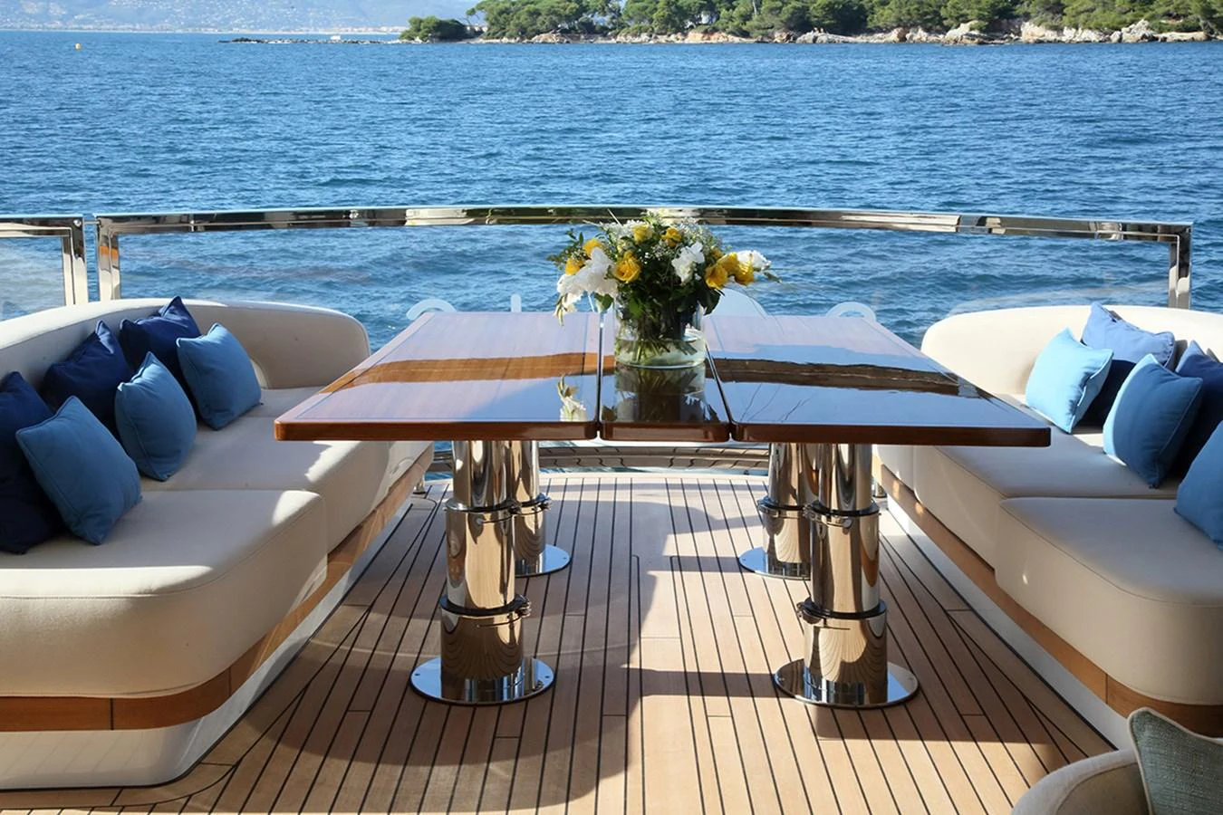 a table with flowers on it aboard SOLIS Yacht for Charter