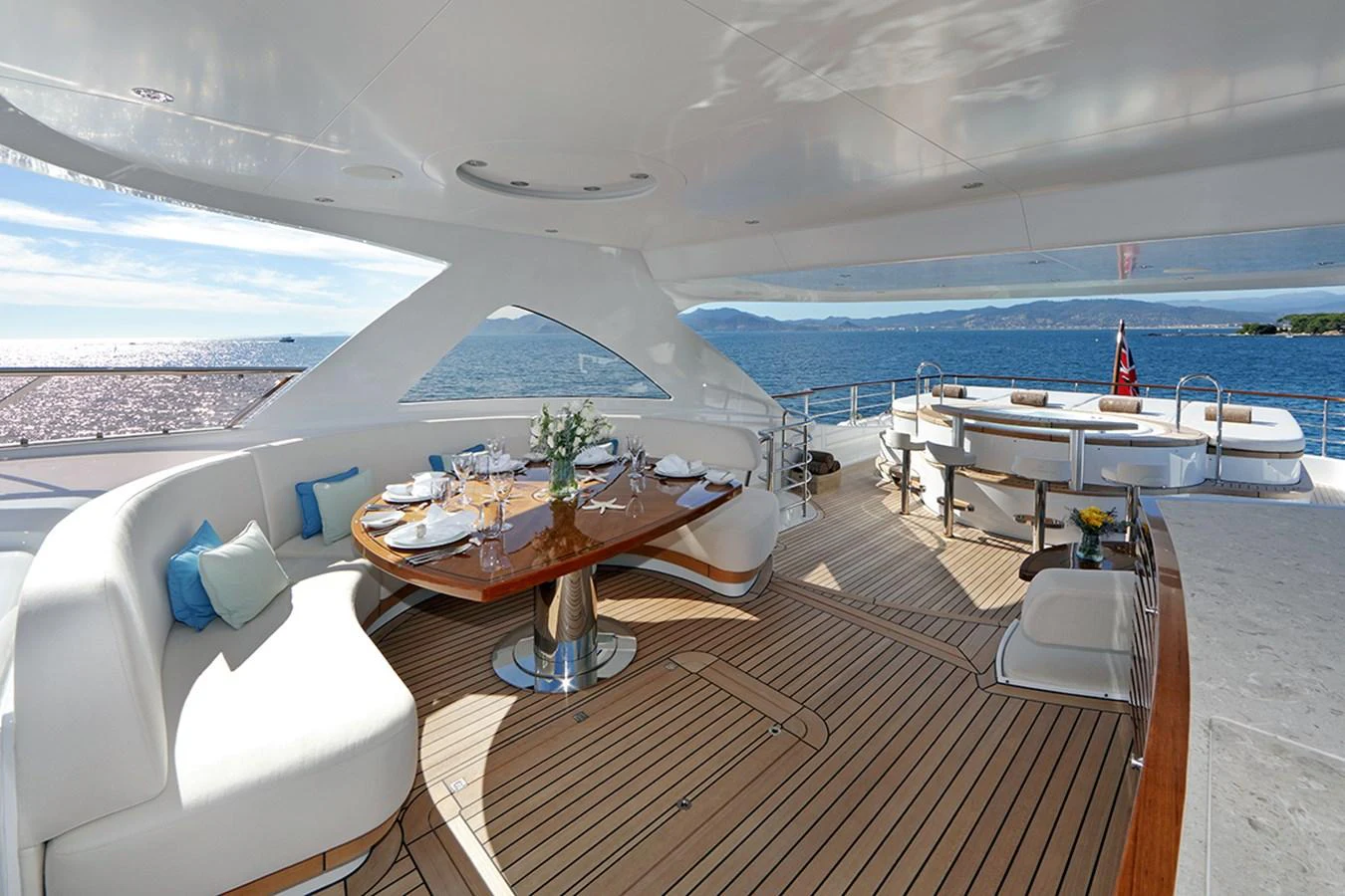 a room with a table and chairs aboard SOLIS Yacht for Charter