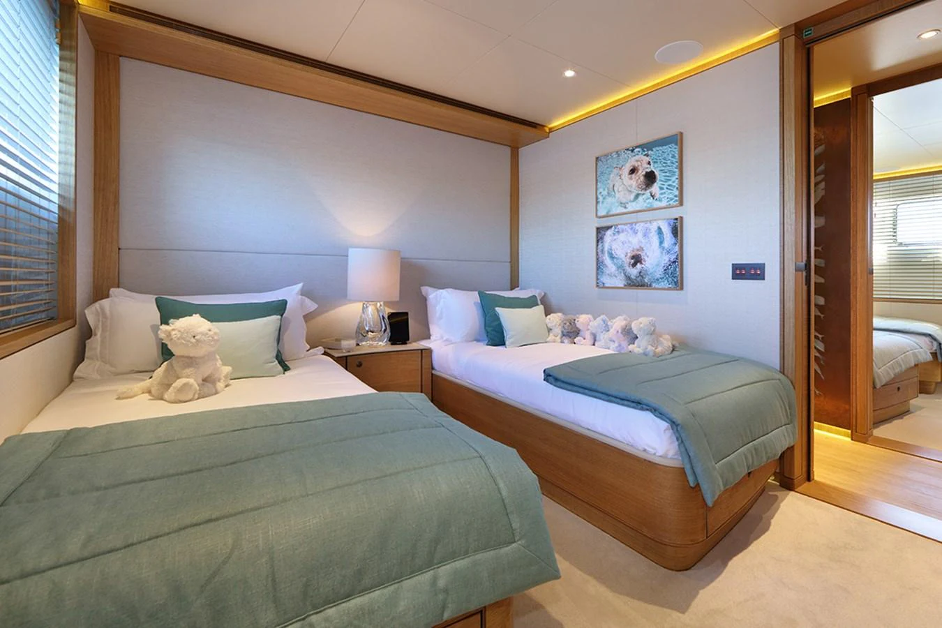 a couple of beds in a hotel room aboard SOLIS Yacht for Charter