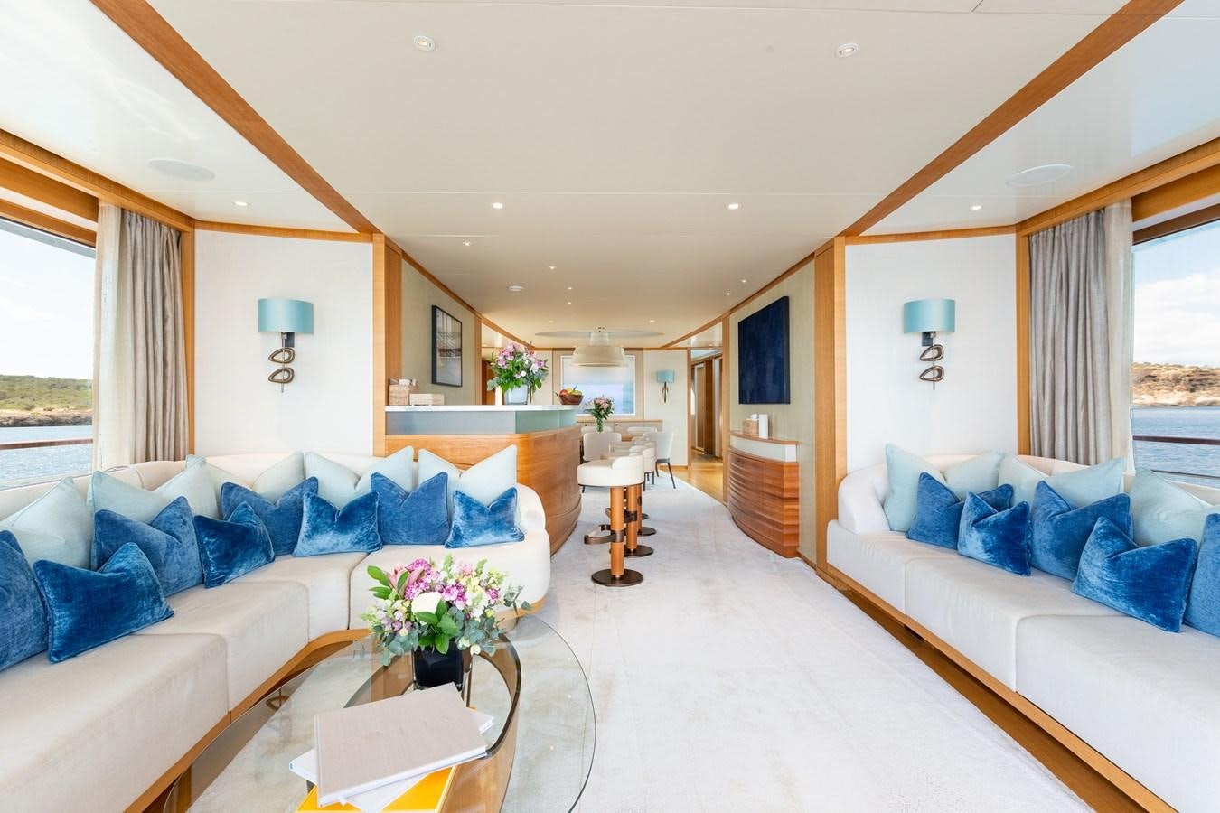 a living room with a couch and a table aboard SOLIS Yacht for Sale