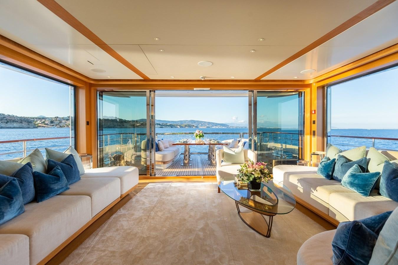 a living room with a large window aboard SOLIS Yacht for Sale
