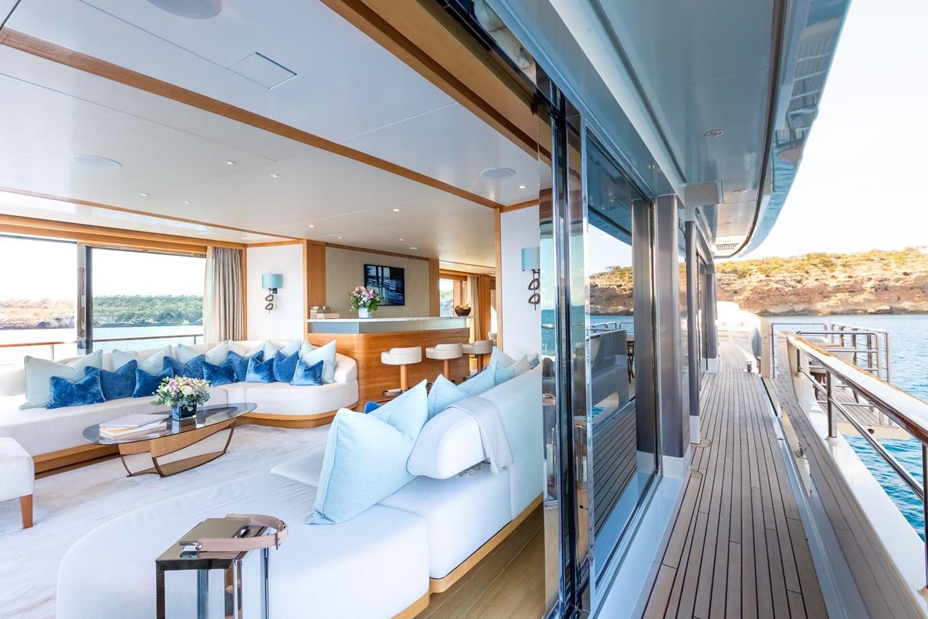 a large room with a balcony aboard SOLIS Yacht for Sale