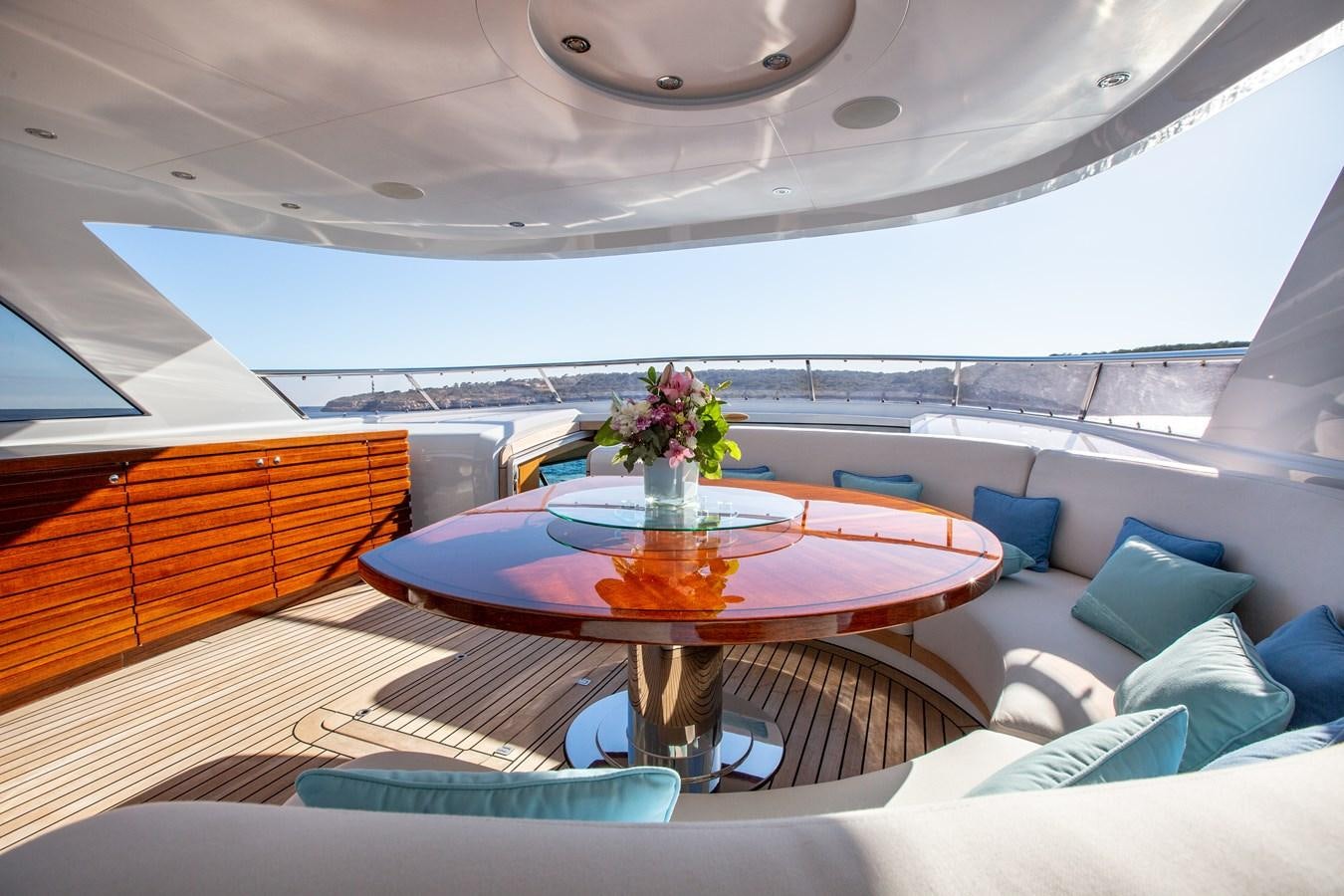 a room with a table and chairs aboard SOLIS Yacht for Sale
