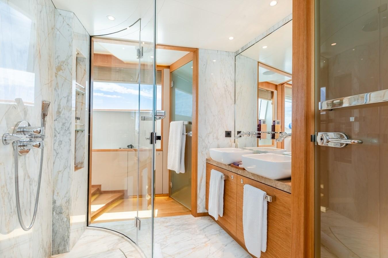 a bathroom with a glass shower aboard SOLIS Yacht for Sale