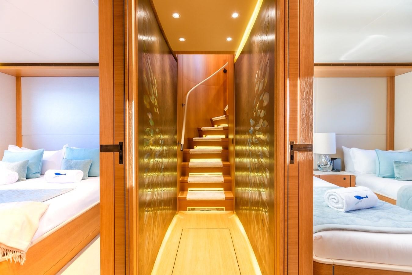 a room with a bed and a closet aboard SOLIS Yacht for Sale