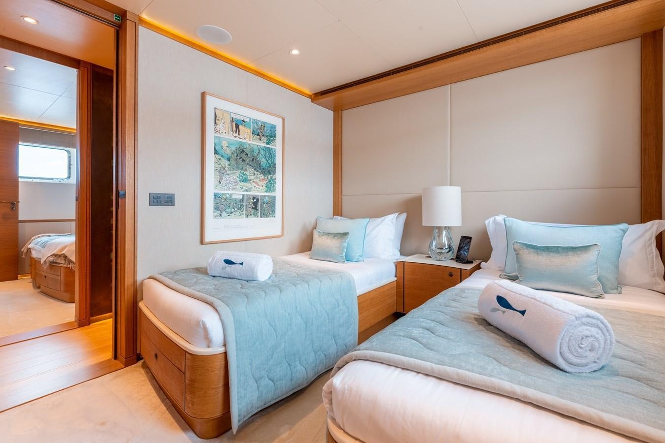 a couple of beds in a hotel room aboard SOLIS Yacht for Sale