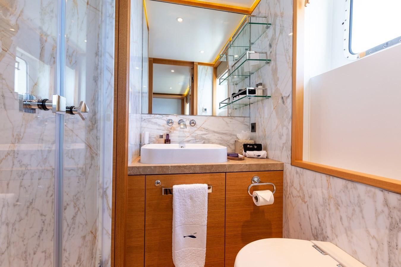 a bathroom with a sink and a mirror aboard SOLIS Yacht for Sale
