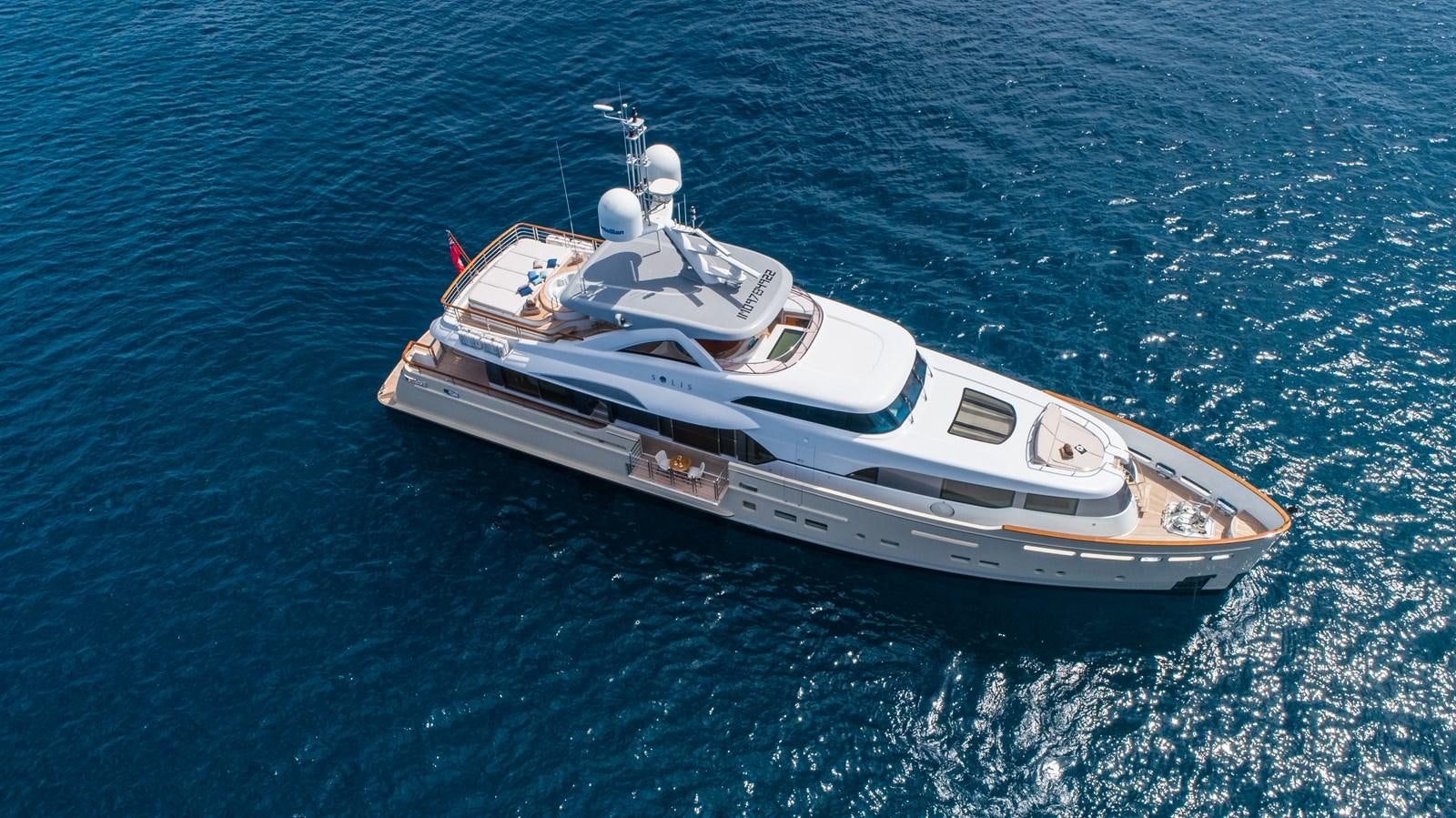 a white boat in the water aboard SOLIS Yacht for Sale