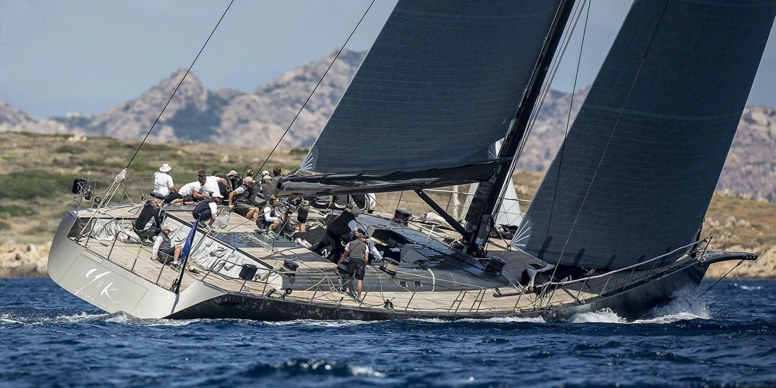 a group of people sailing on a boat aboard Y3K Yacht for Sale