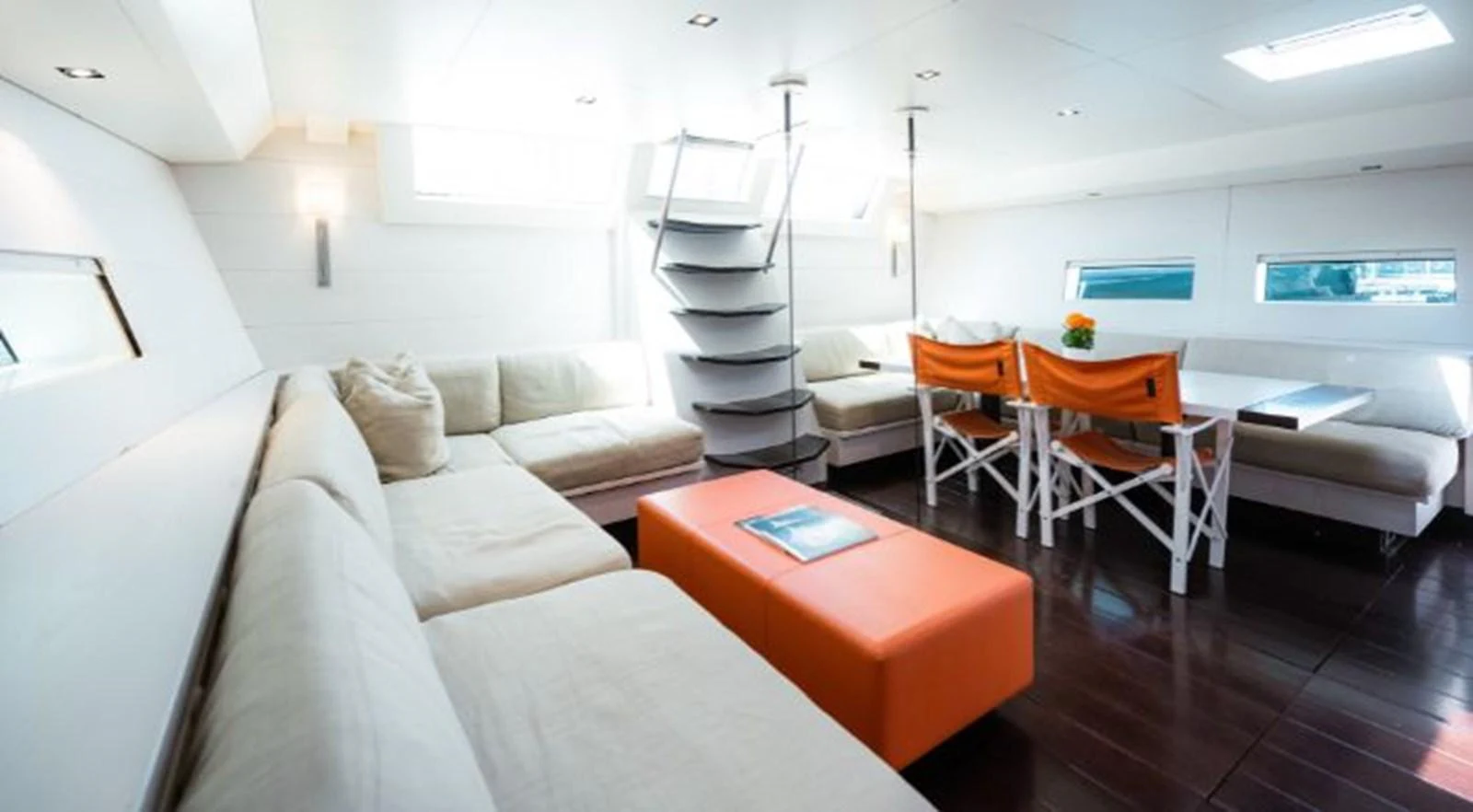 a room with a couch and a table aboard Y3K Yacht for Sale