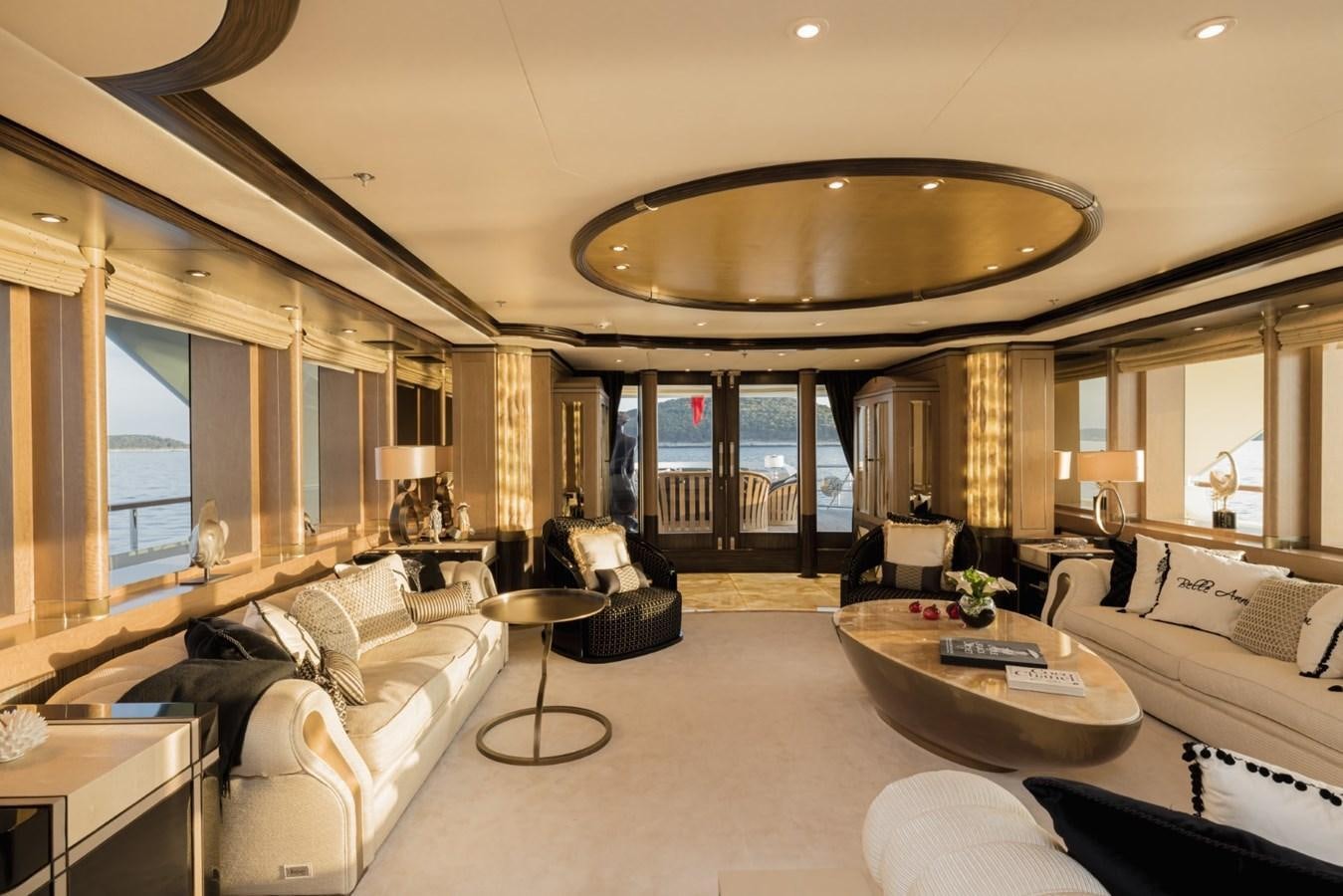 a living room with a large chandelier aboard BELLE ANNA Yacht for Sale