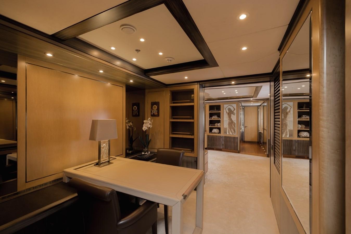 a large room with a table and chairs aboard BELLE ANNA Yacht for Sale