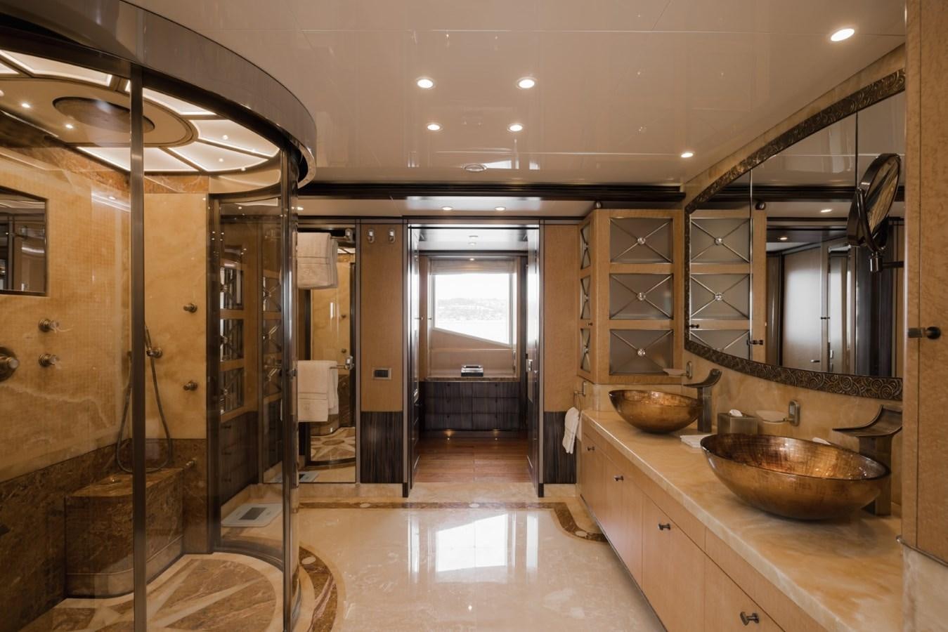 a large bathroom with a large mirror aboard BELLE ANNA Yacht for Sale