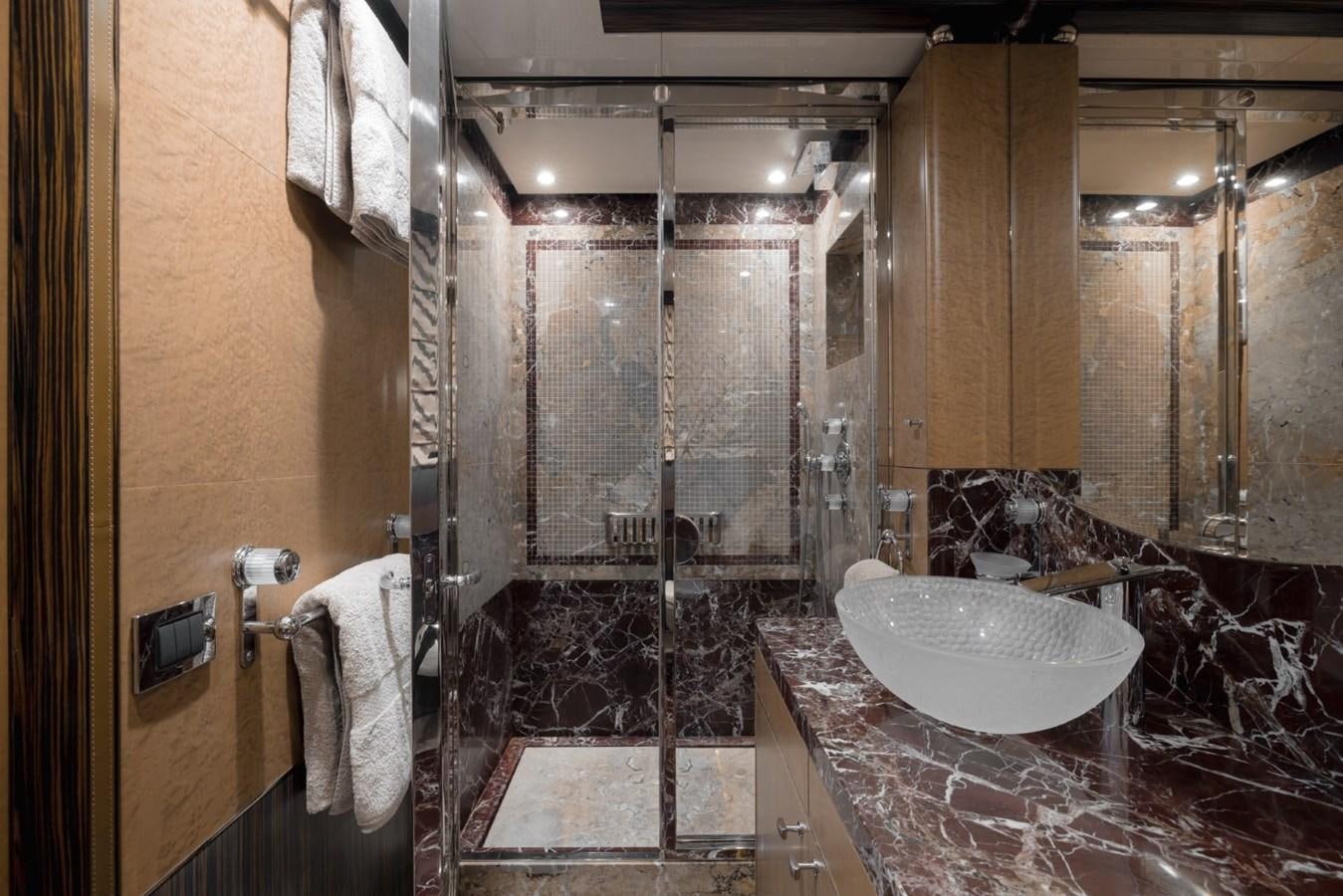 a bathroom with a sink and a large mirror aboard BELLE ANNA Yacht for Sale