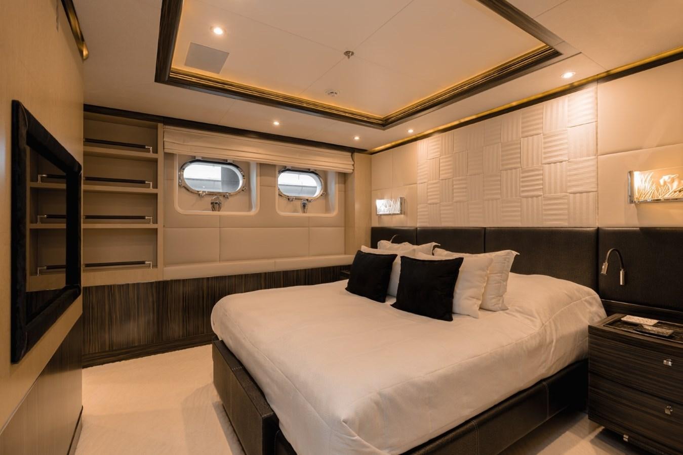 a room with a bed and a mirror aboard BELLE ANNA Yacht for Sale