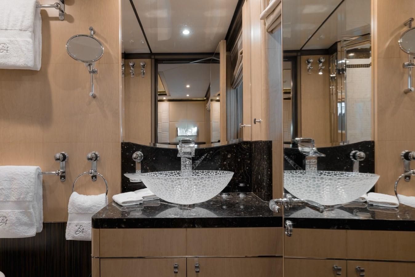 a bathroom with a sink and mirror aboard BELLE ANNA Yacht for Sale
