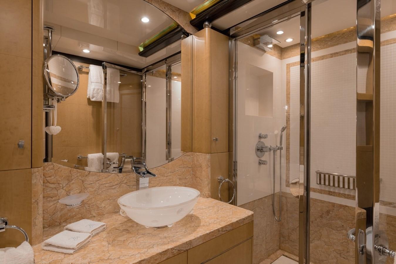 a bathroom with a large mirror aboard BELLE ANNA Yacht for Sale
