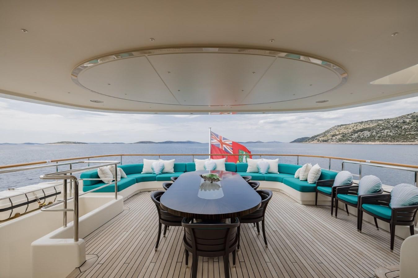 a pool with a table and chairs aboard BELLE ANNA Yacht for Sale