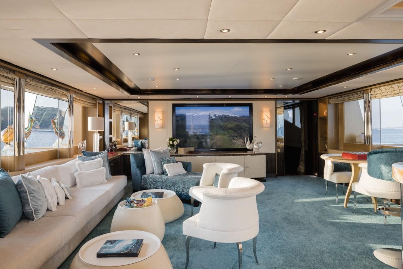 a living room with a large screen aboard BELLE ANNA Yacht for Sale