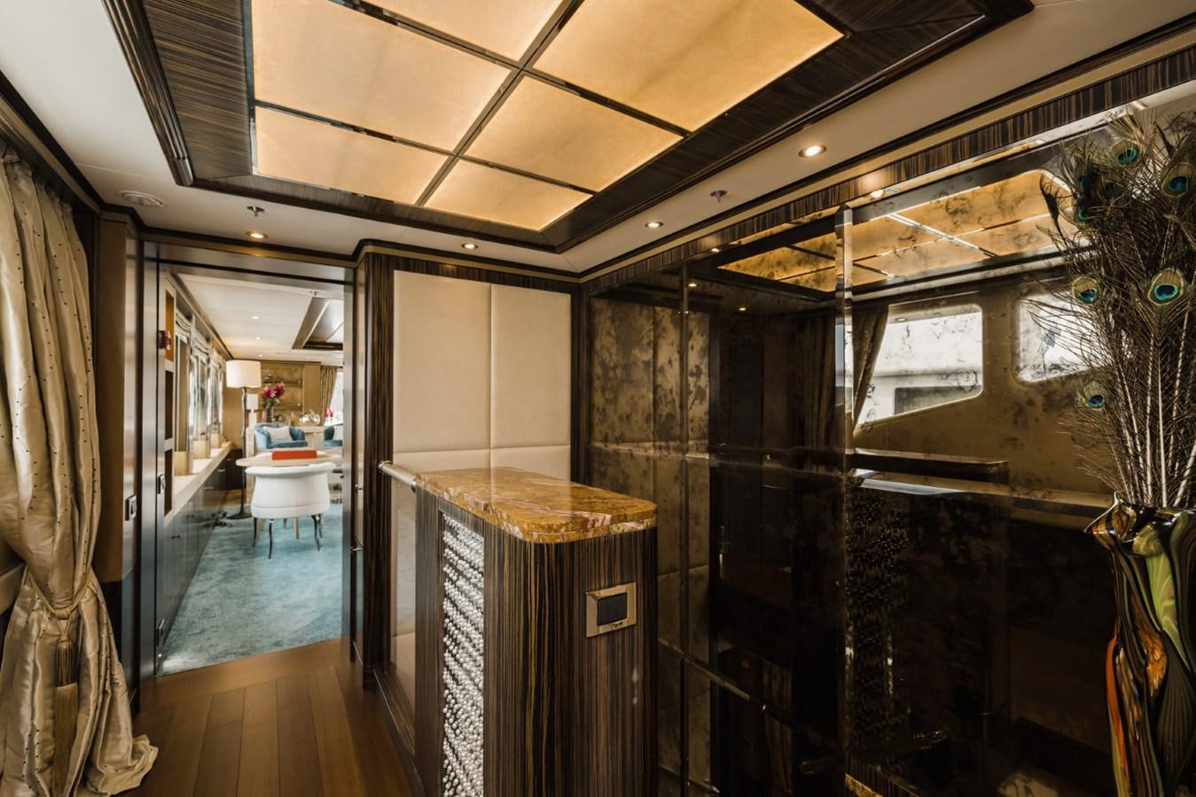 a room with a table and chairs aboard BELLE ANNA Yacht for Sale