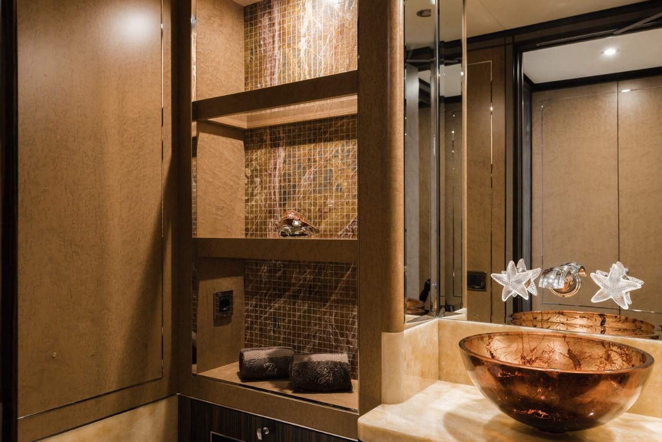 a bathroom with a large mirror aboard BELLE ANNA Yacht for Sale