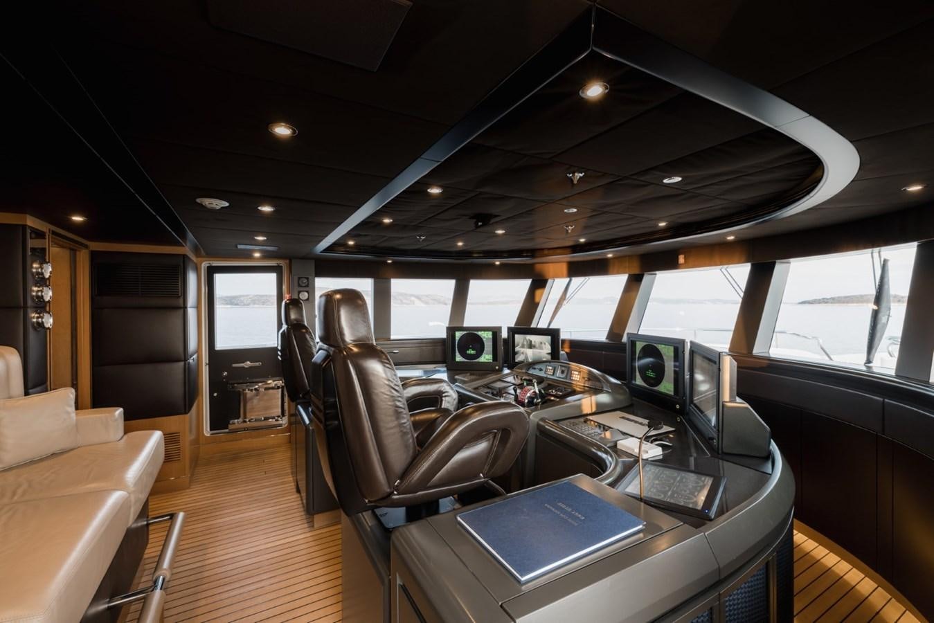 inside of a vehicle with many monitors and seats aboard BELLE ANNA Yacht for Sale