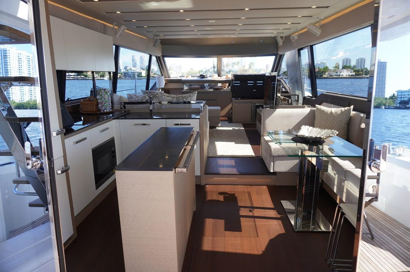 a room with a bed and a table aboard 2017 PRESTIGE 680  Yacht for Sale