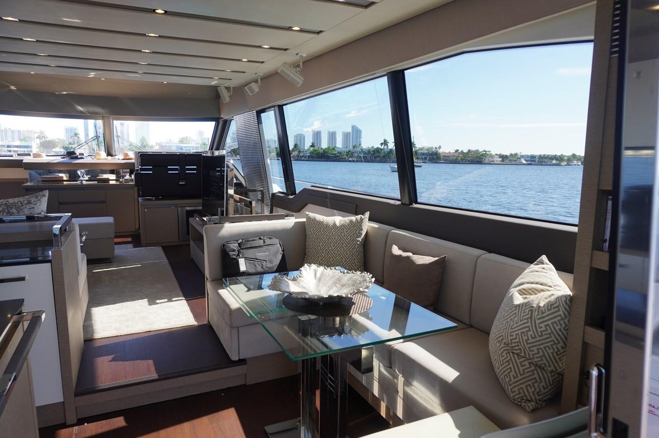 a living room with a large window aboard 2017 PRESTIGE 680  Yacht for Sale