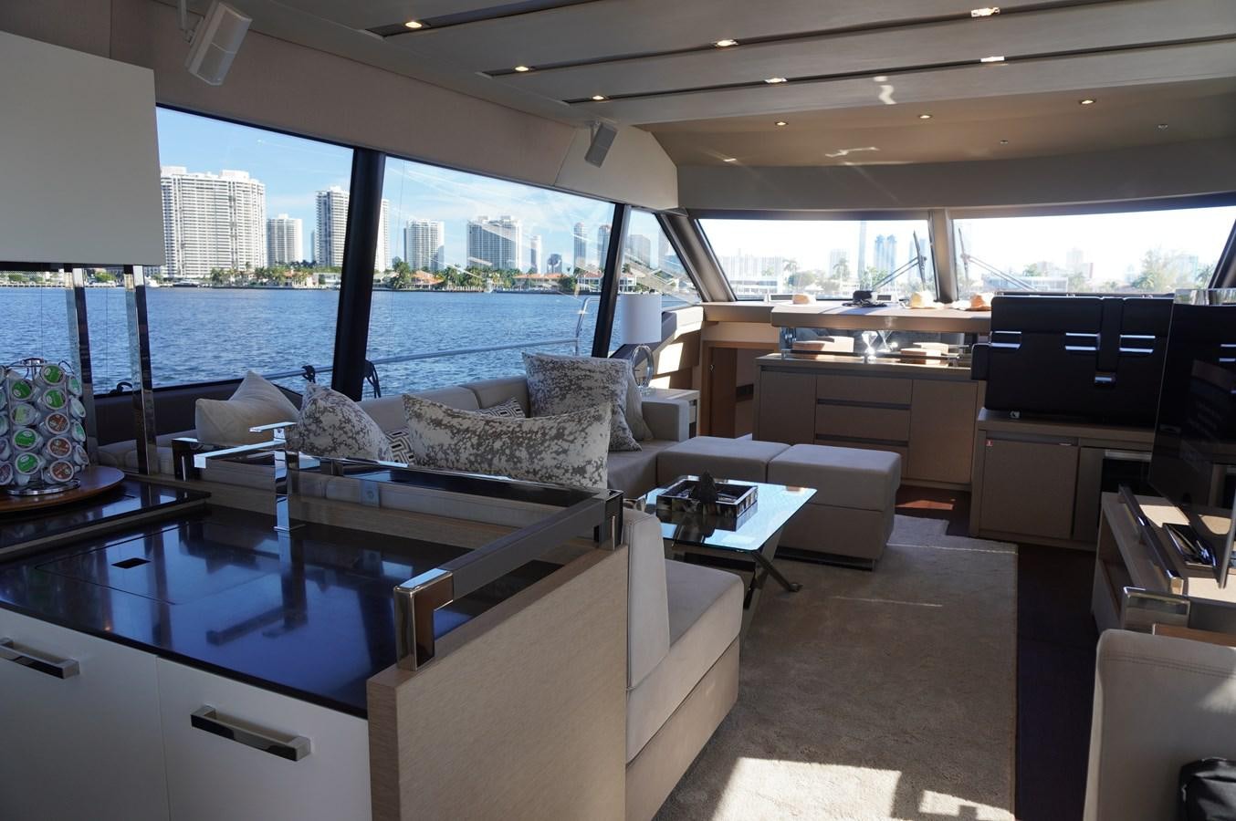 a living room with a large glass window aboard 2017 PRESTIGE 680  Yacht for Sale