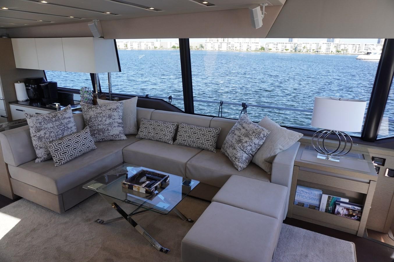 a living room with a large blue ocean aboard 2017 PRESTIGE 680  Yacht for Sale