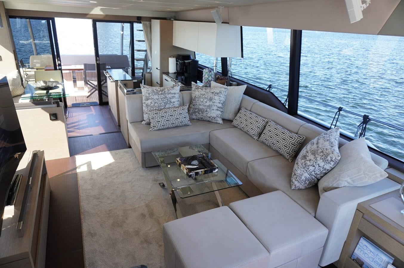 a living room with a large window aboard 2017 PRESTIGE 680  Yacht for Sale