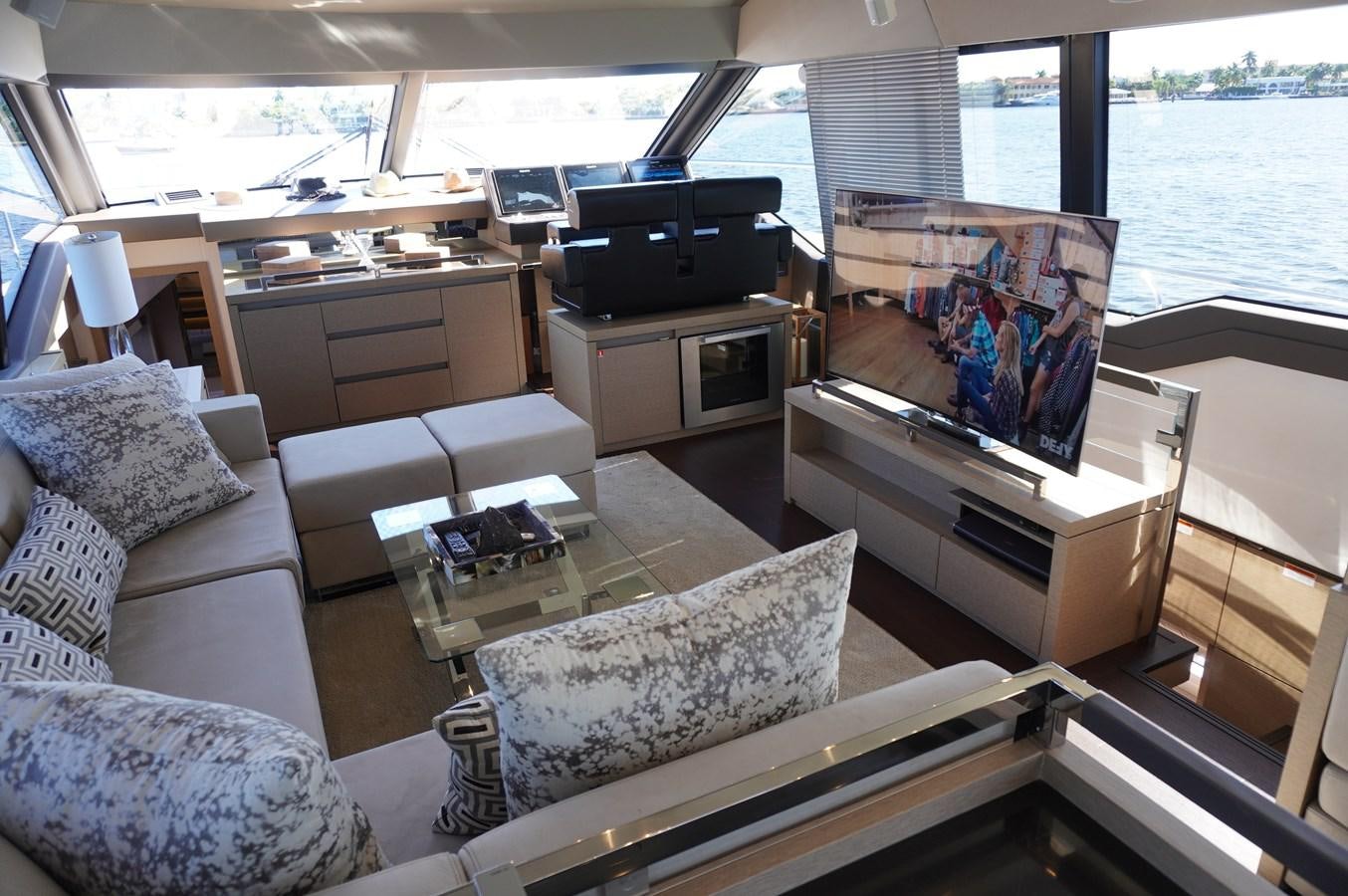 a living room with a large window aboard 2017 PRESTIGE 680  Yacht for Sale