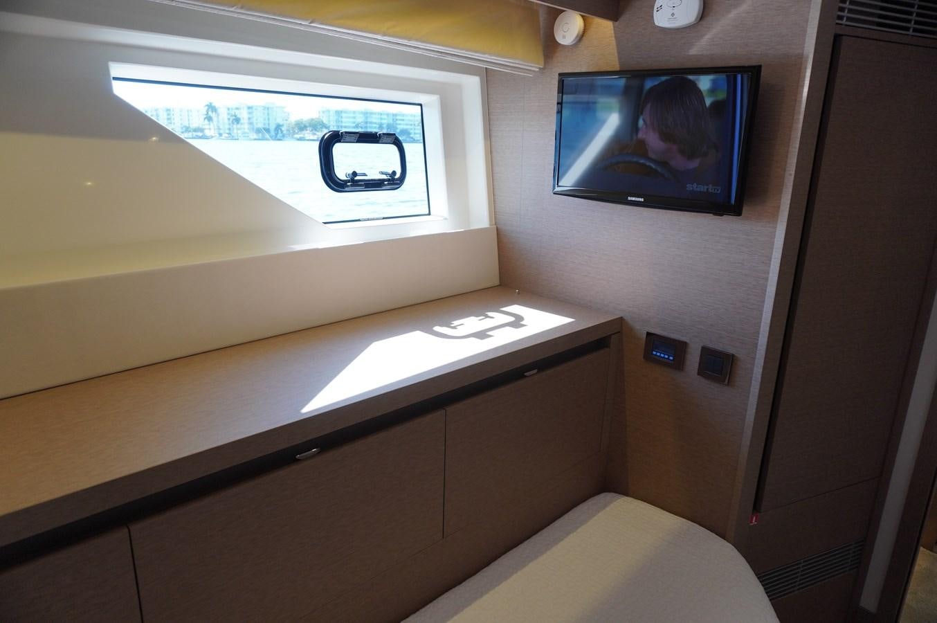 a tv on a wall aboard 2017 PRESTIGE 680  Yacht for Sale