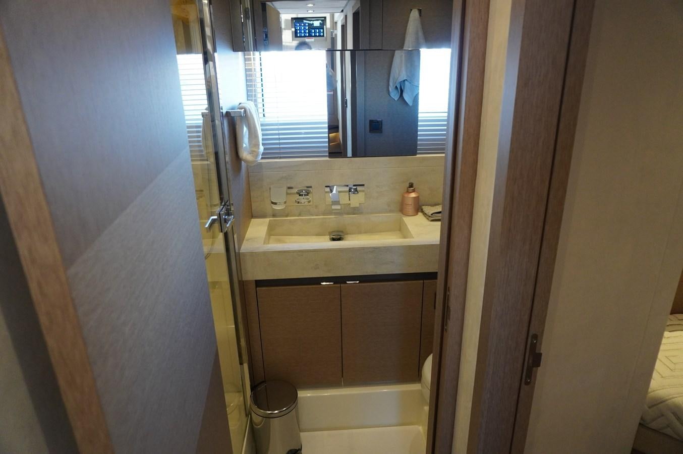 a bathroom with a sink and a mirror aboard 2017 PRESTIGE 680  Yacht for Sale