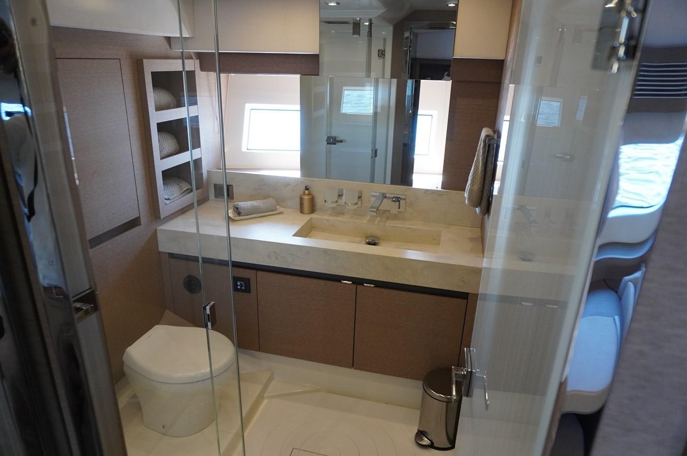 a bathroom with a sink and a toilet aboard 2017 PRESTIGE 680  Yacht for Sale