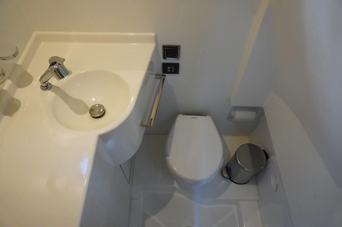 a small bathroom with a toilet aboard 2017 PRESTIGE 680  Yacht for Sale