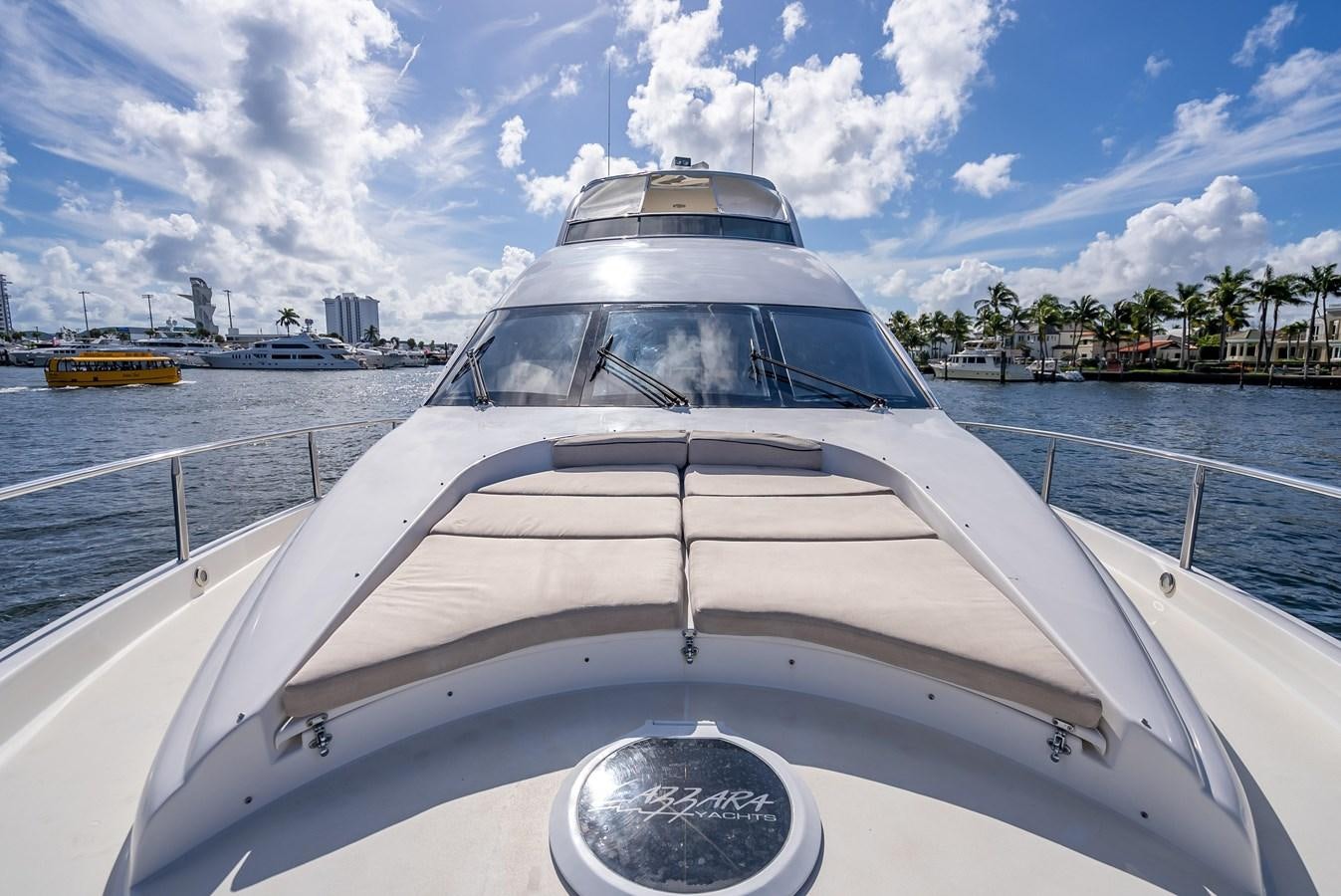 a white yacht on the water aboard COMPROMISE Yacht for Sale