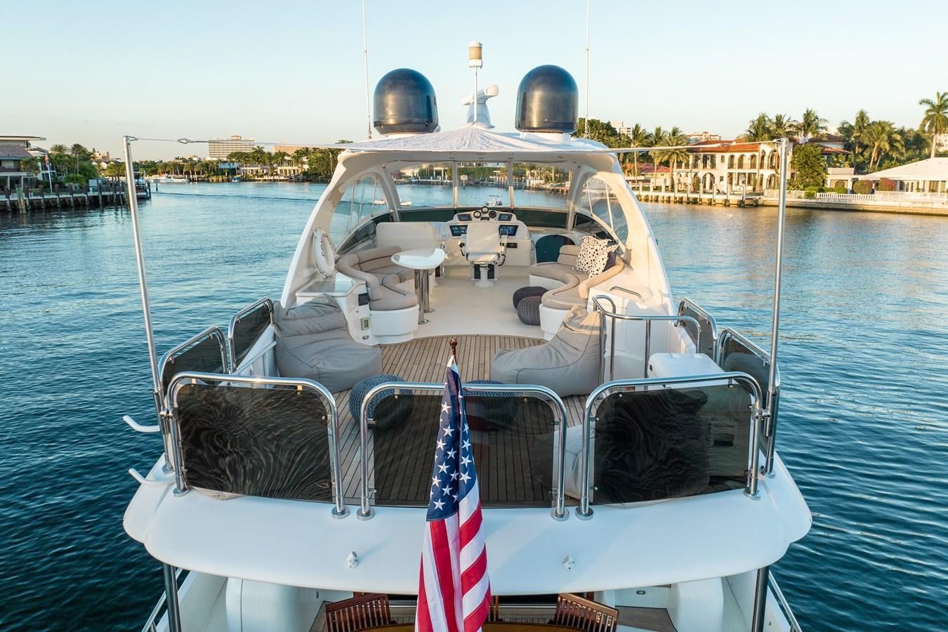 a boat with a flag on the front aboard COMPROMISE Yacht for Sale