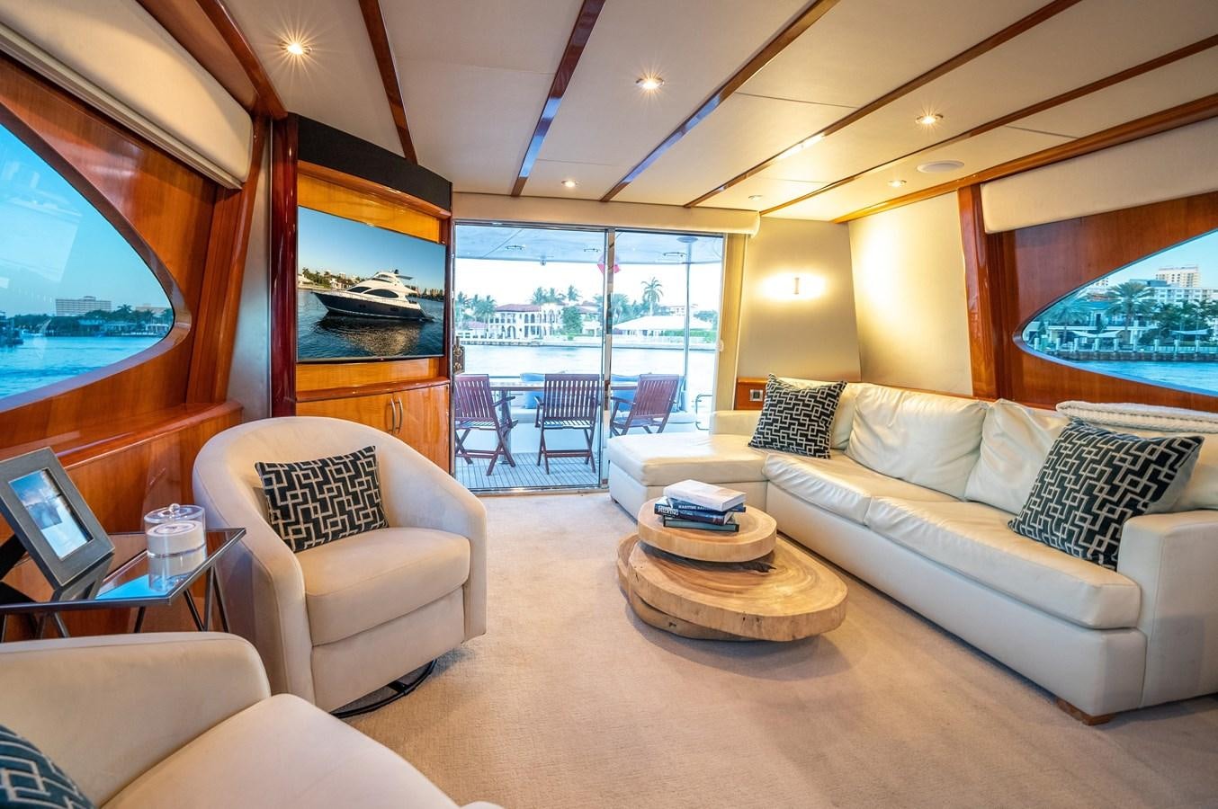 a living room with a large window aboard COMPROMISE Yacht for Sale