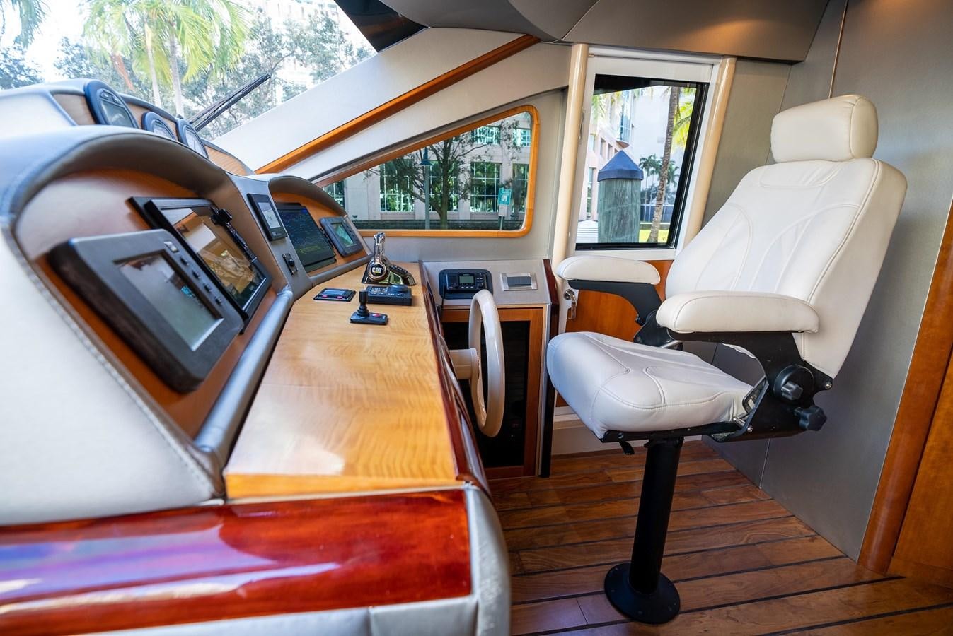 a car with a radio and a chair aboard COMPROMISE Yacht for Sale