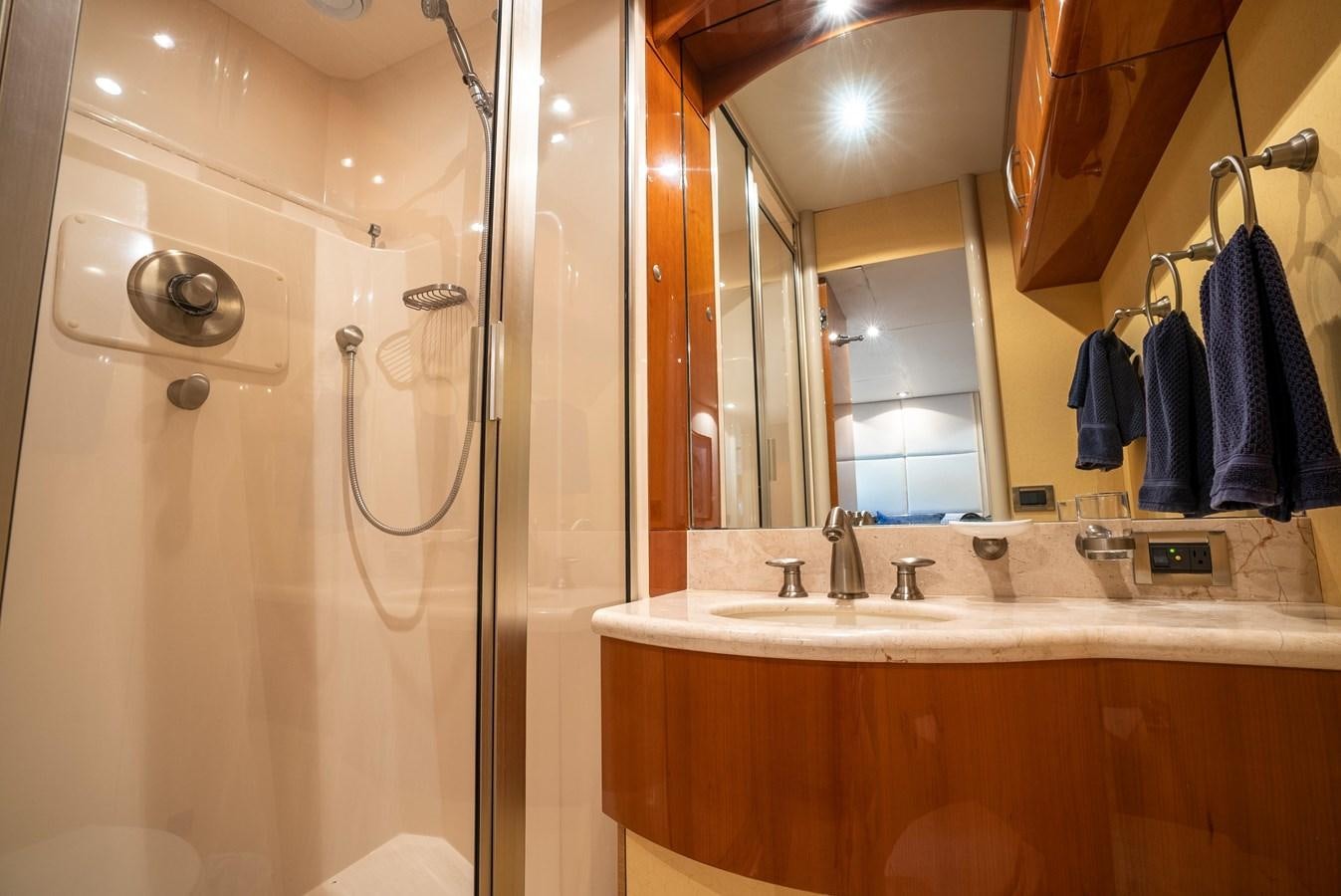 a bathroom with a large mirror aboard COMPROMISE Yacht for Sale