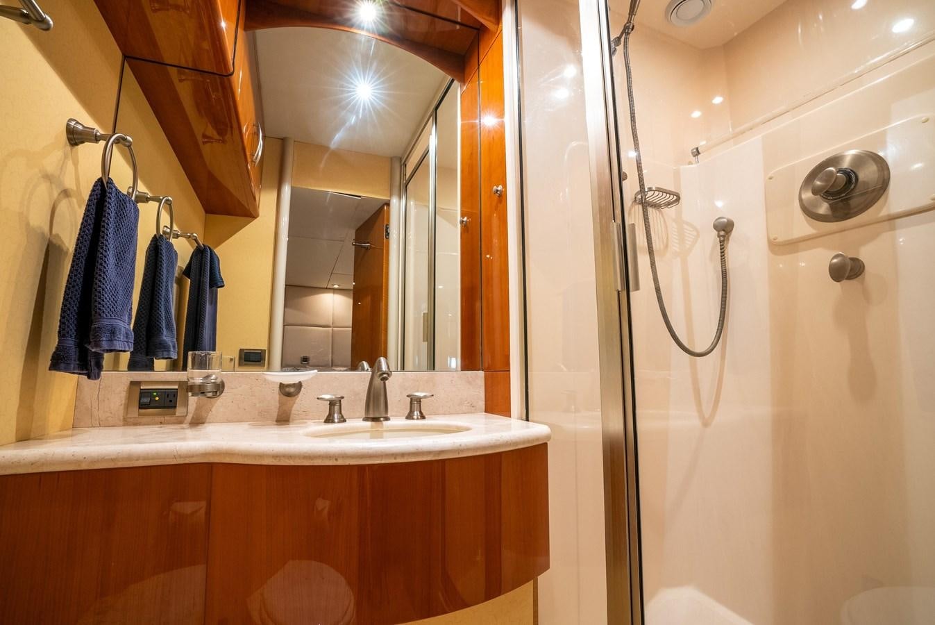 a bathroom with a sink and a shower aboard COMPROMISE Yacht for Sale